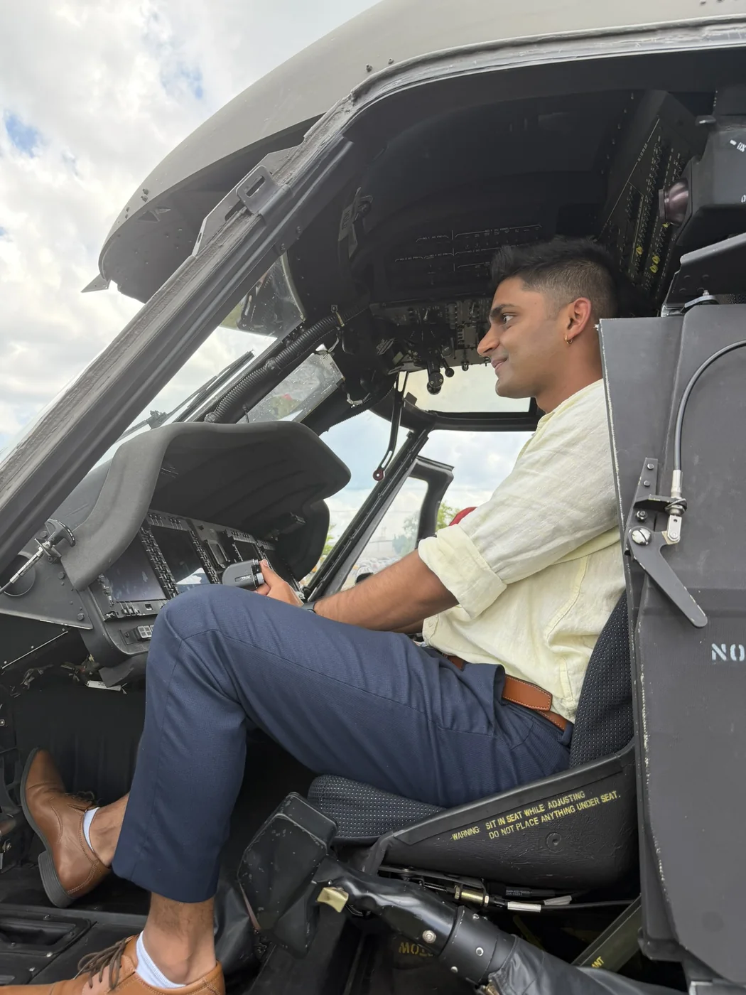 Haitish seated in an aircraft cockpit